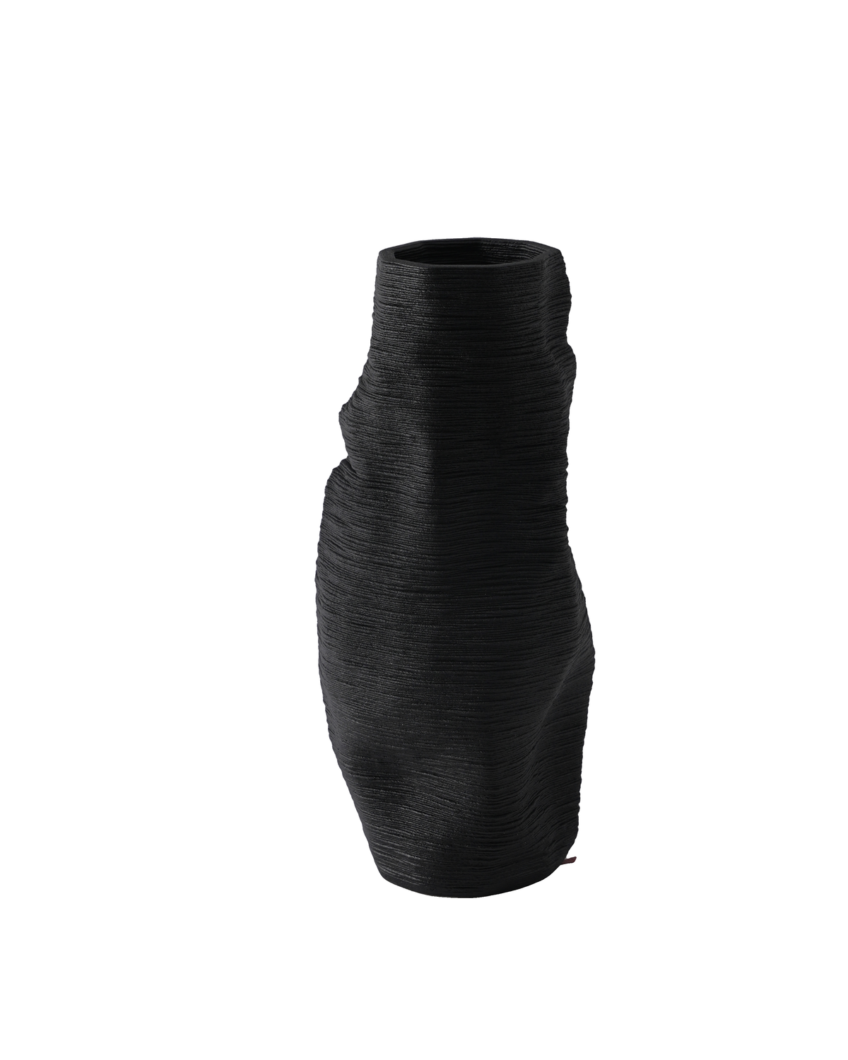 Close view of the black vase showing fine printed ridges and its folded, leaning outline