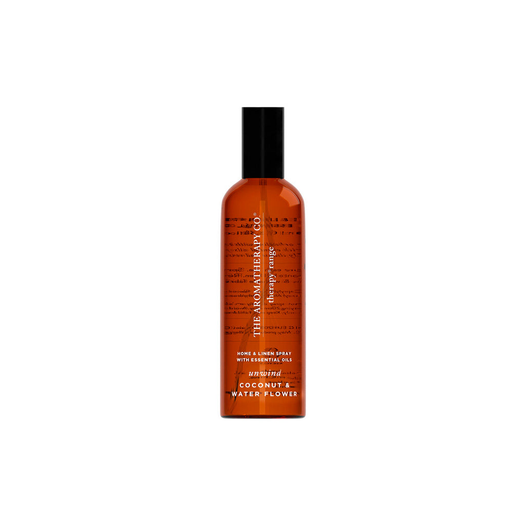 Therapy Unwind Coconut & Water Flower room and linen spray in an amber bottle on a white background
