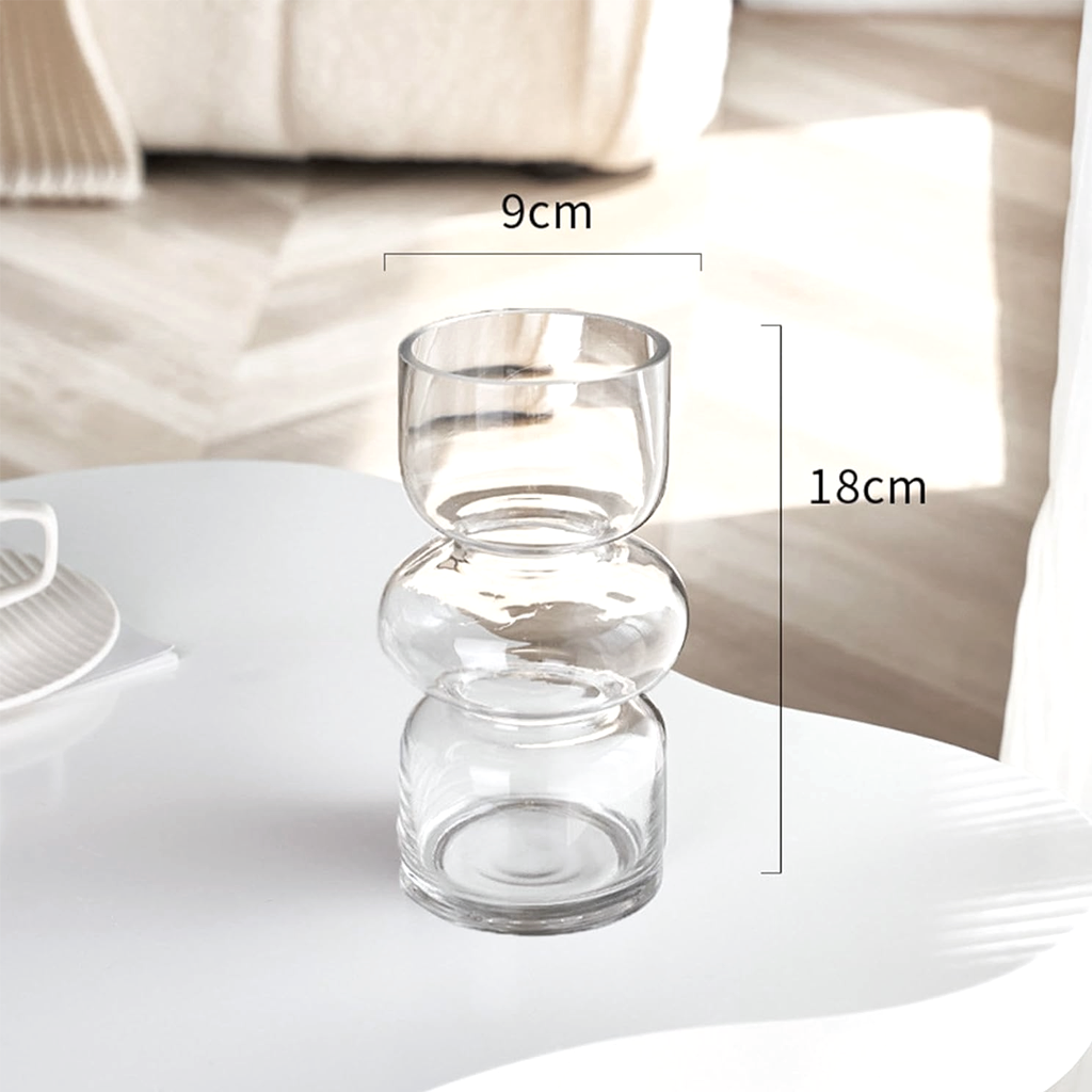 Size guide for the clear Shea glass vase, 9cm wide and 18cm high, on a white table