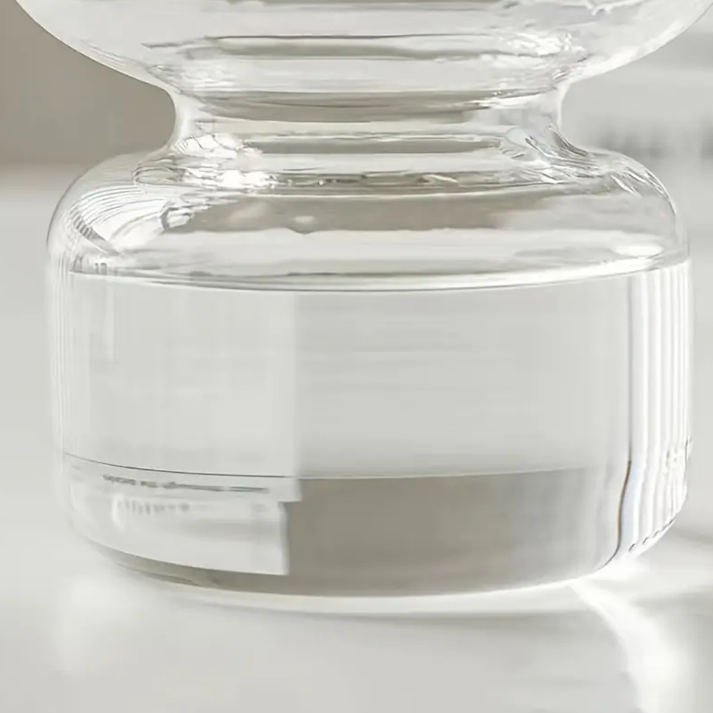Close view of the clear Shea vase base, showing the thick glass and ribbed joint