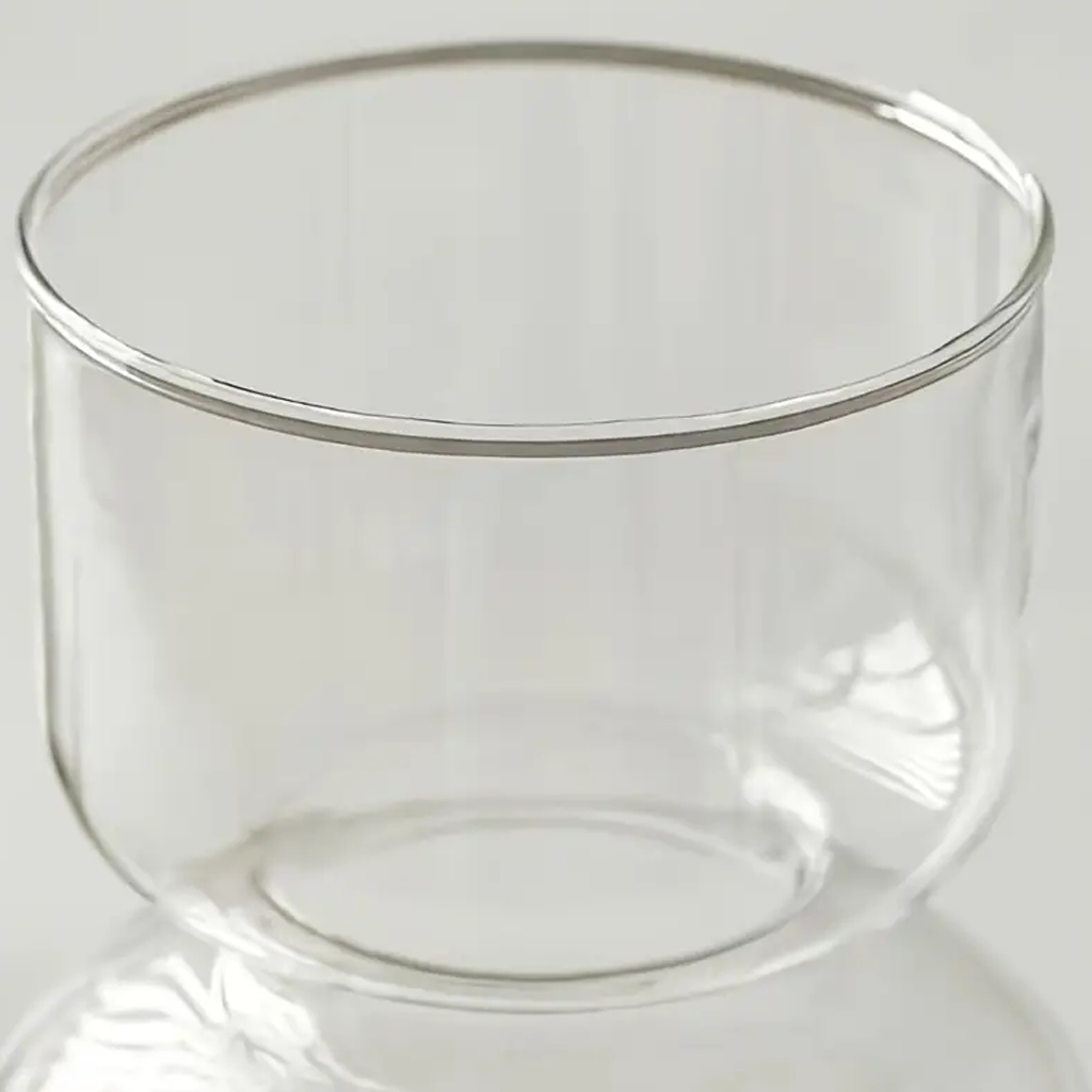 Close view of the clear Shea vase rim and upper bowl against a pale background