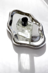 Silver cloud tray with perfume bottle modern sculptural decor styling