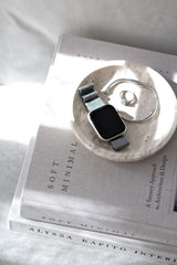 Soft Minimal by Norm Architects styled with marble dish, silver jewellery and smartwatch in natural light
