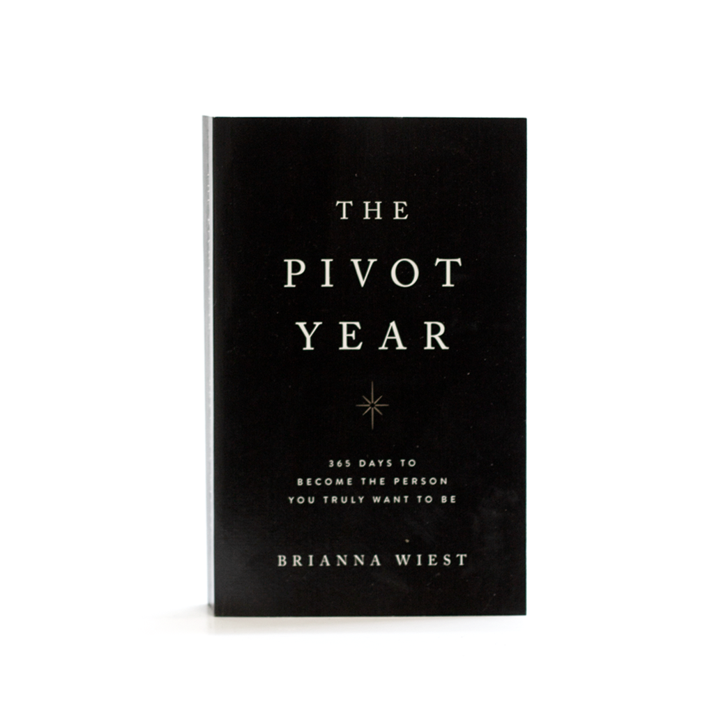 The Pivot Year black hardcover standing on a plain white background, title and author in pale type