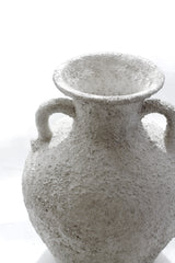 Close-up of Thira Vase handle and rim, showing weathered stone texture.