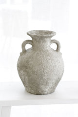 Sculptural Thira Vase styled on a white surface with soft grey light