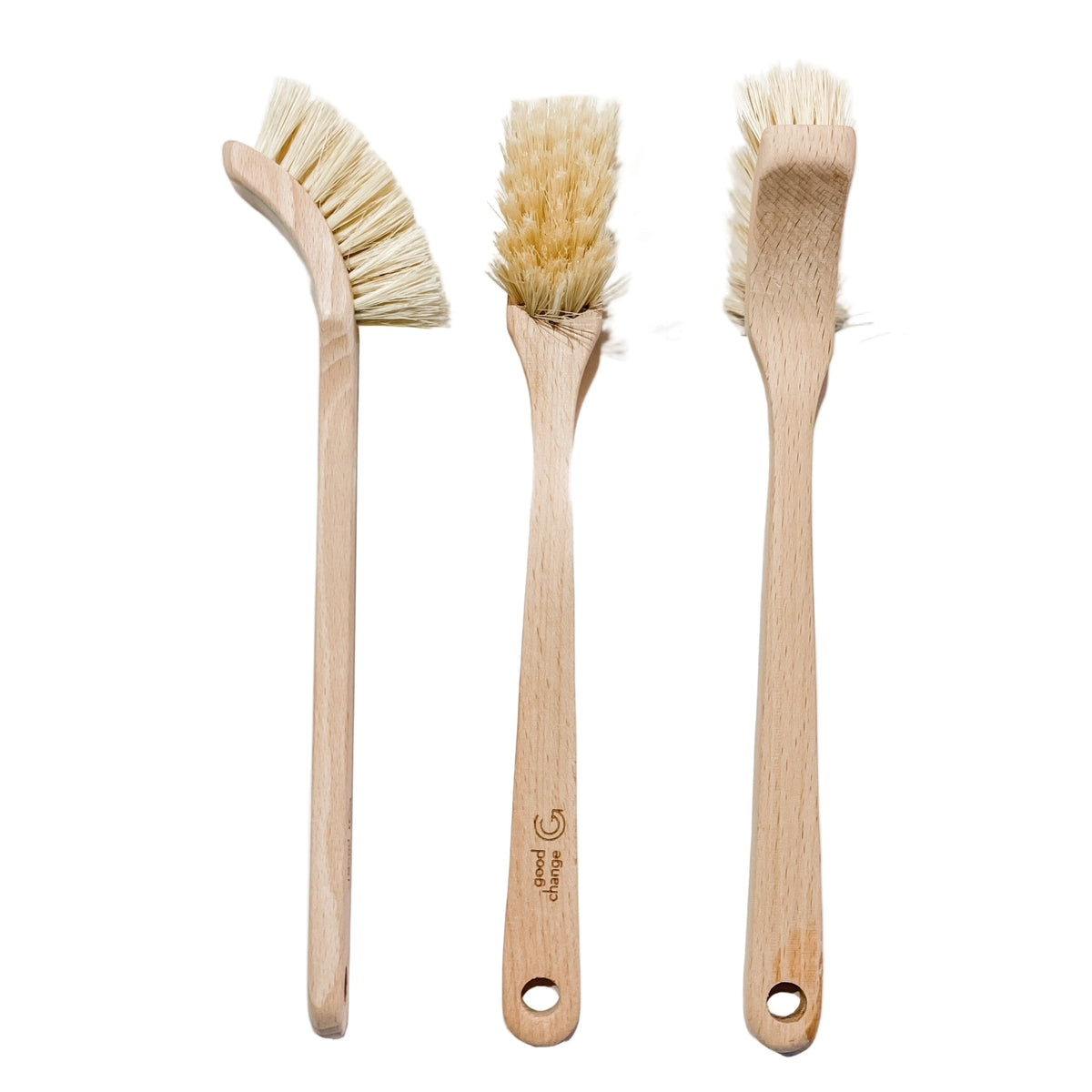 Three Good Change wooden dish brushes on a white kitchen bench