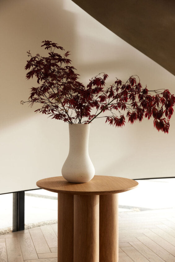 Round Side Table in black oak styled with a lamp