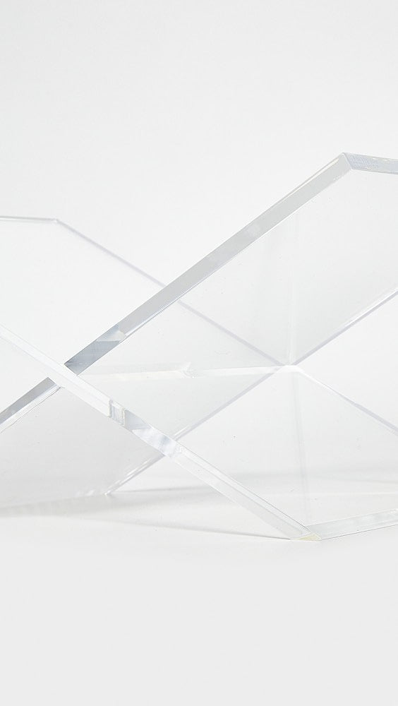 Acrylic book holder displaying an art print