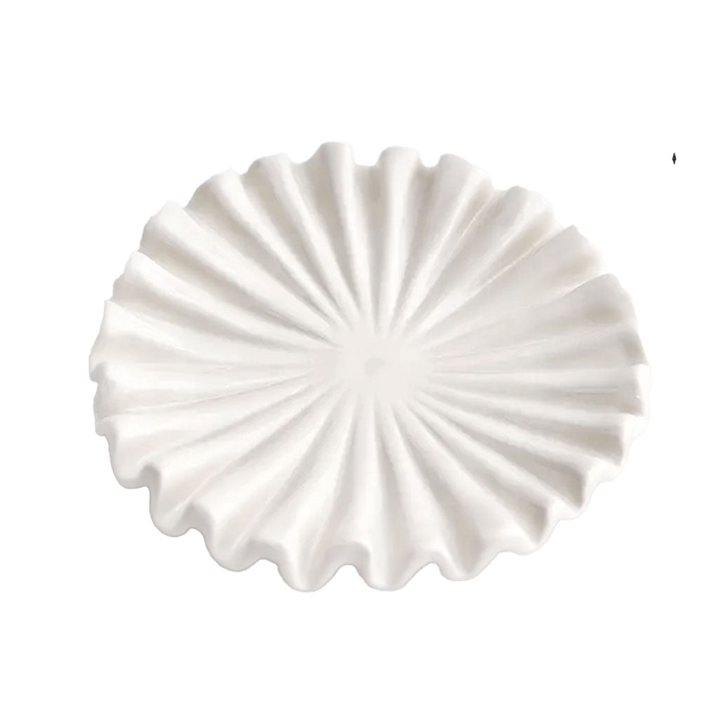 Glossy white ruffle ceramic display tray with a fluted edge on a white background