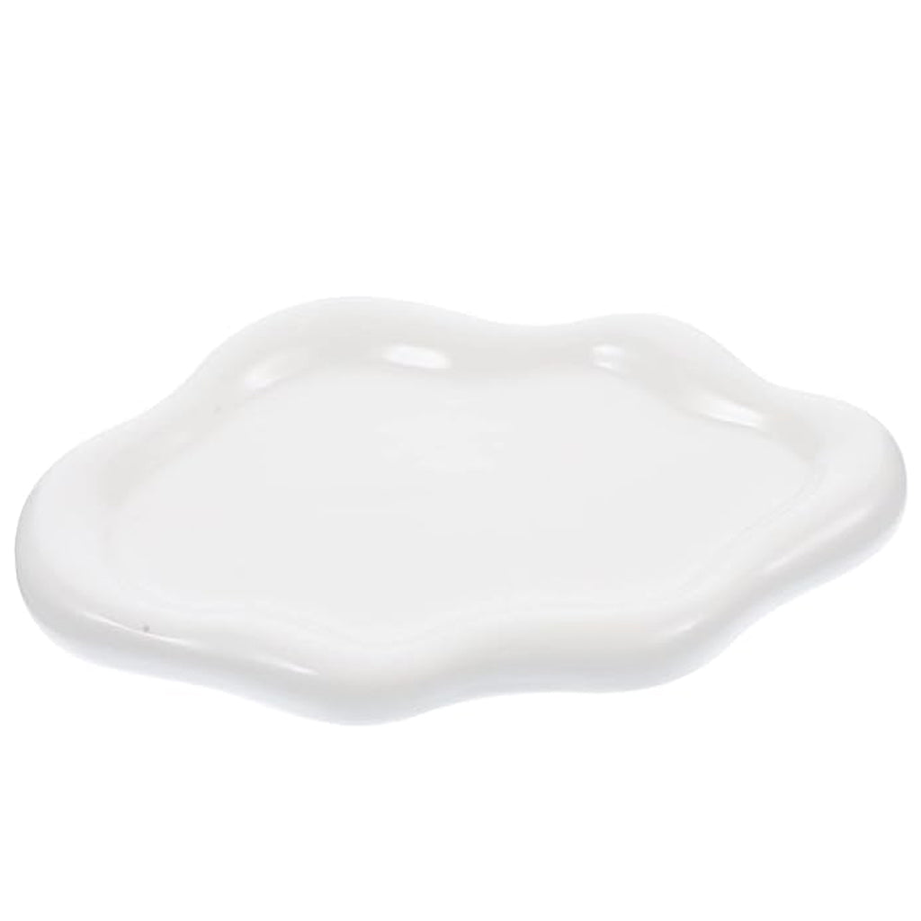 Glossy white cloud ceramic tray with a wavy edge, on a plain background