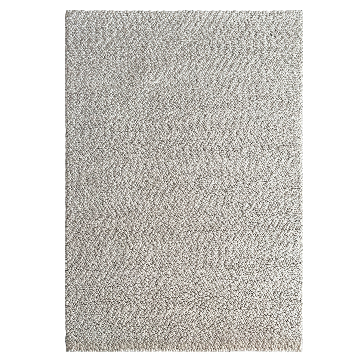 Tundra Pebble Sand Rug in a soft sand tone with a chunky loop texture, shown flat on white
