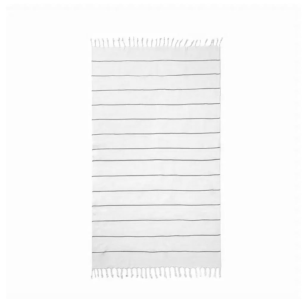 Turkish towel in white with thin grey stripes, laid flat to show the knotted fringe