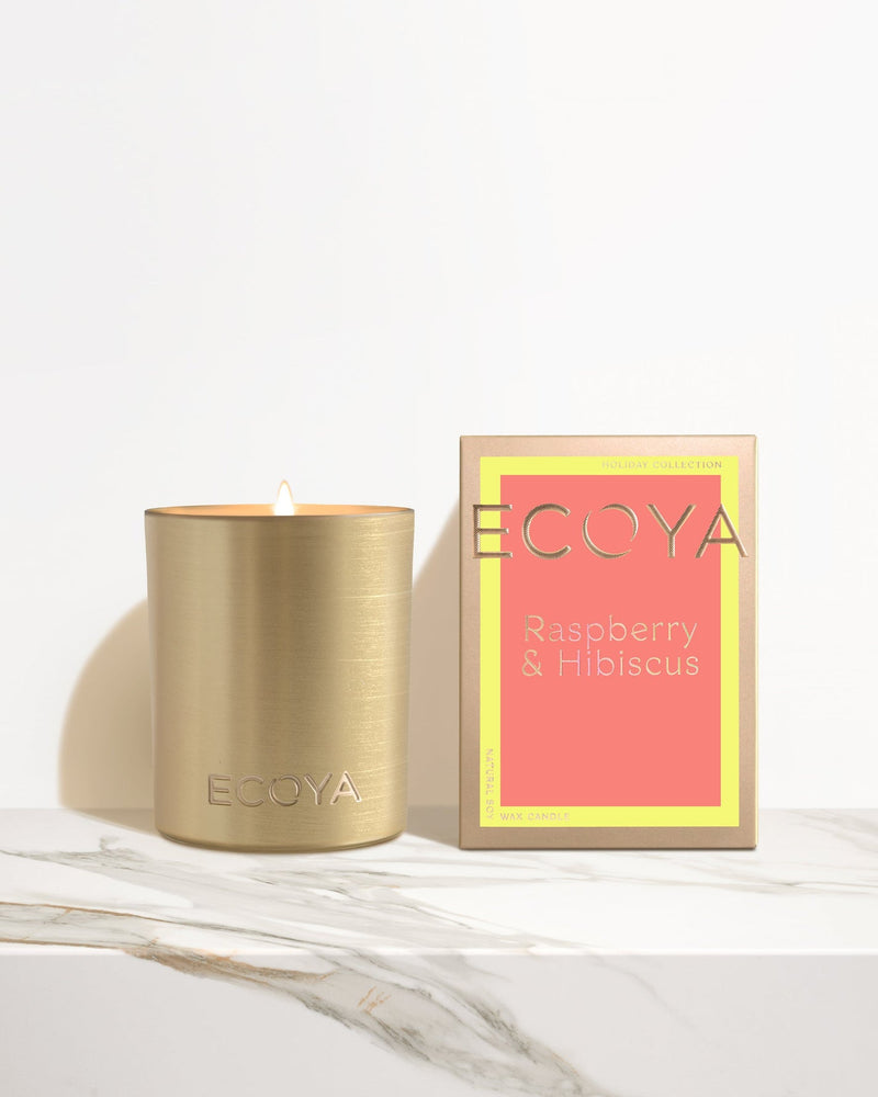 Discover the luxurious Ecoya Holiday: Raspberry & Hibiscus Goldie Candle with a delightful citrus & tangerine scent, perfect for creating a cozy ambiance. Indulge in the enchanting fragrance while enjoying the elegant Gold.