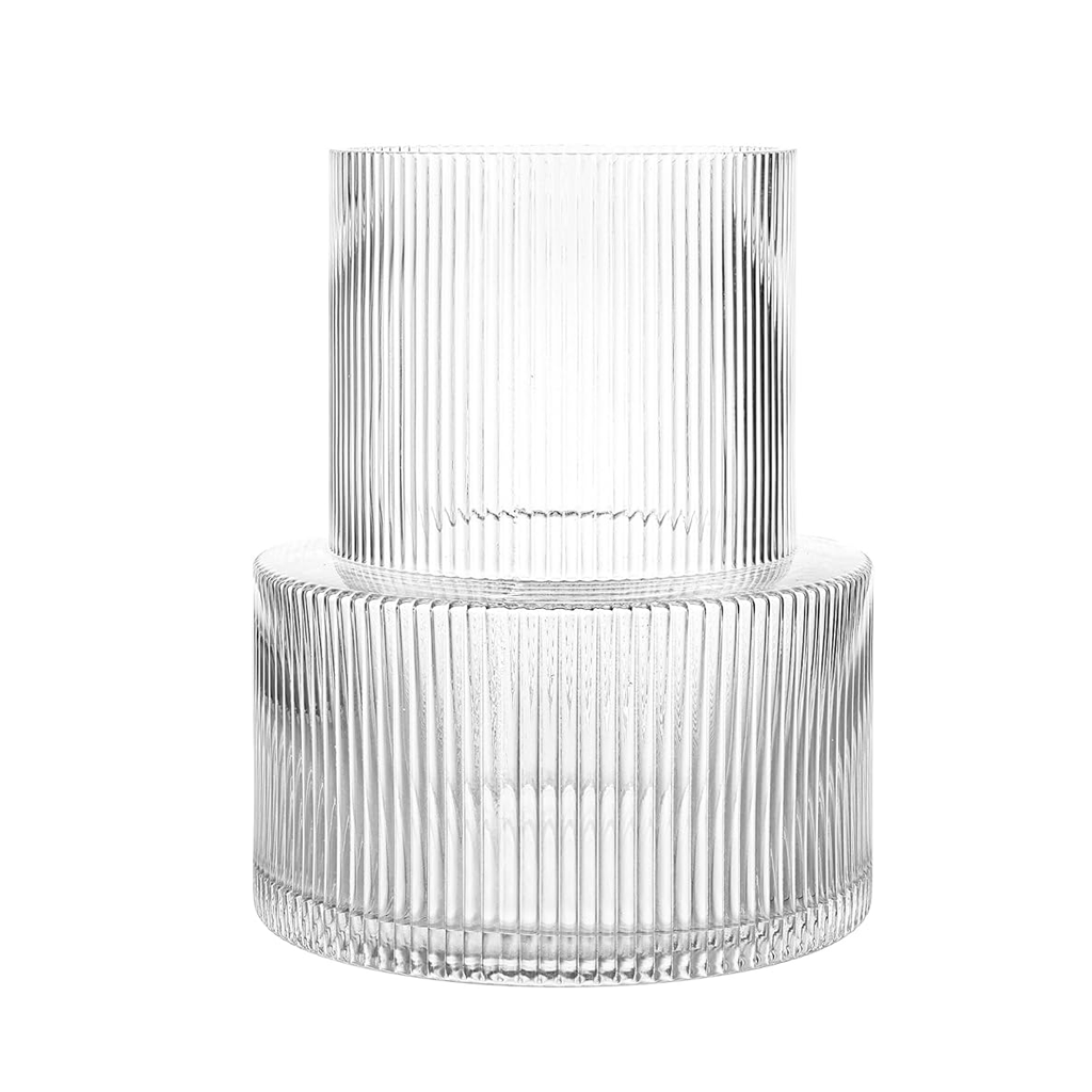 Wide ribbed glass vase in clear, stepped shape with a narrow neck rising from a broad fluted base