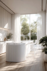 White steel wire stool styled at kitchen island with natural light
