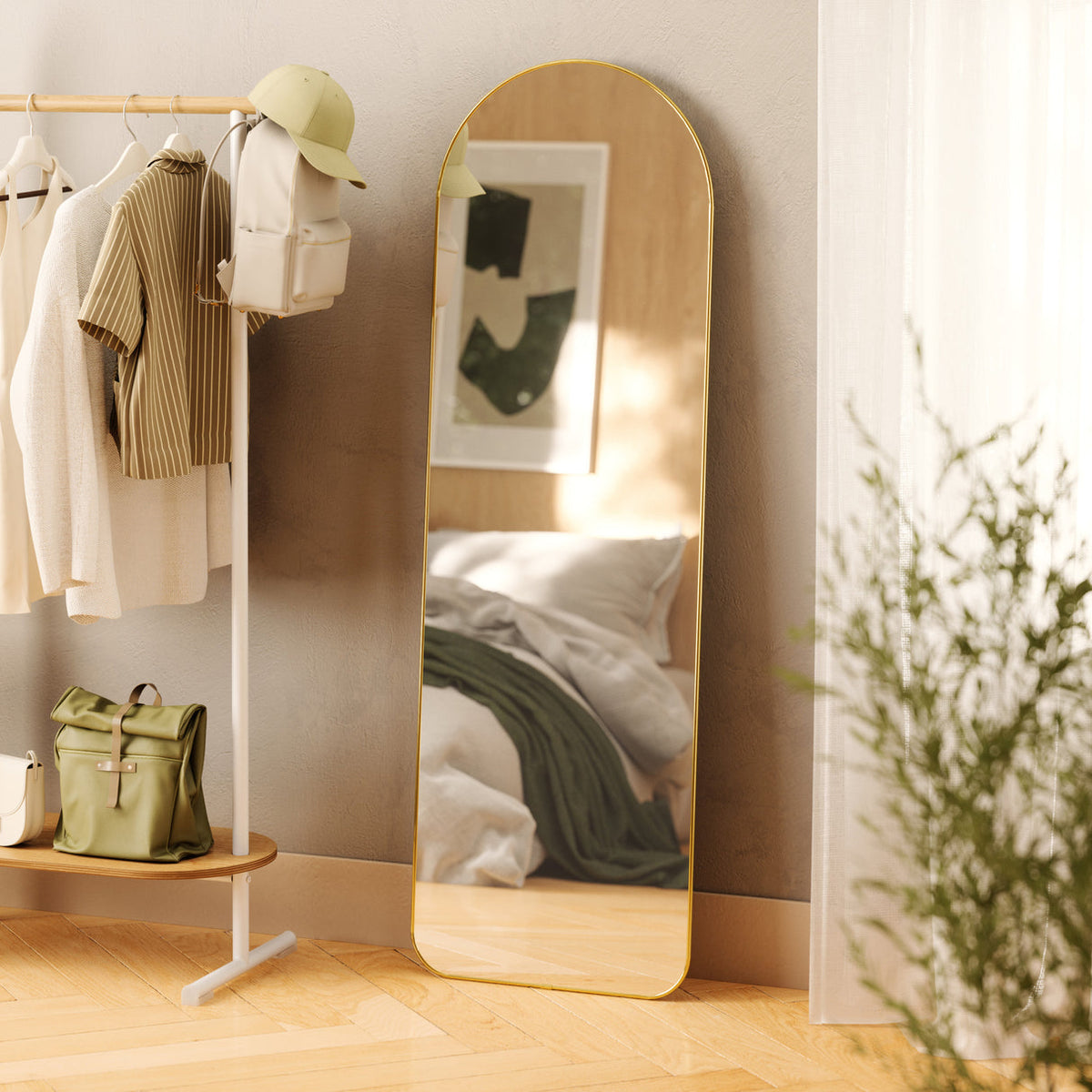 Umbra Hubba arched leaning mirror leaning against a wall, slim 4cm profile