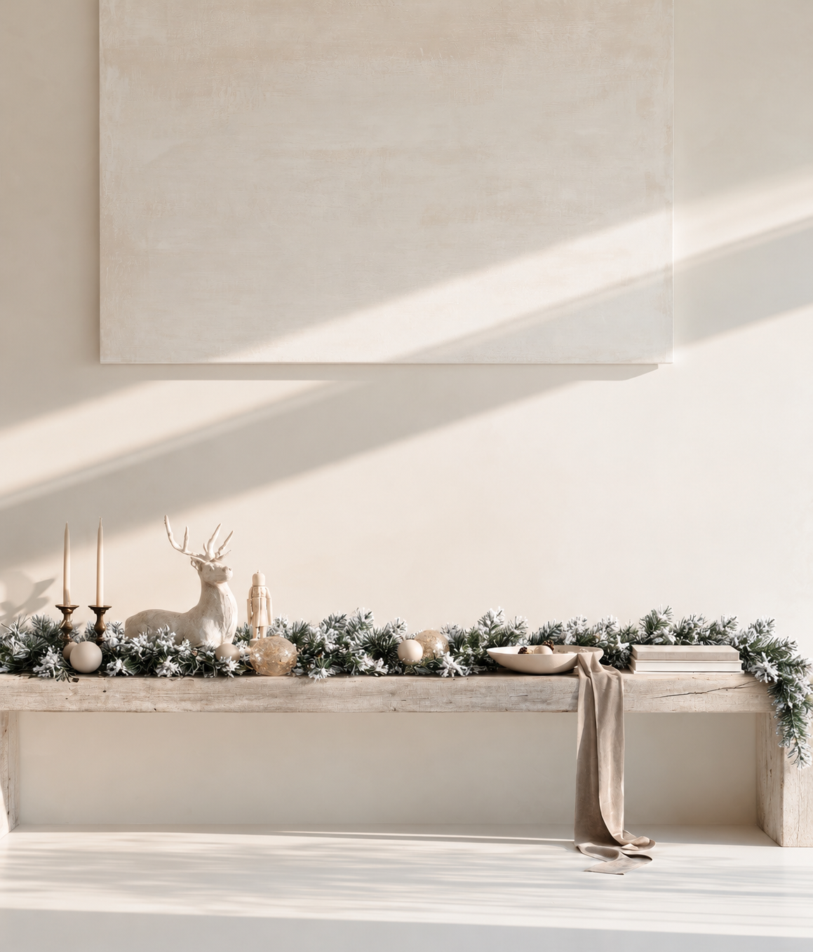 Royale Flocked Christmas Garland along a timber ledge with a white deer, brass candlesticks and baubles