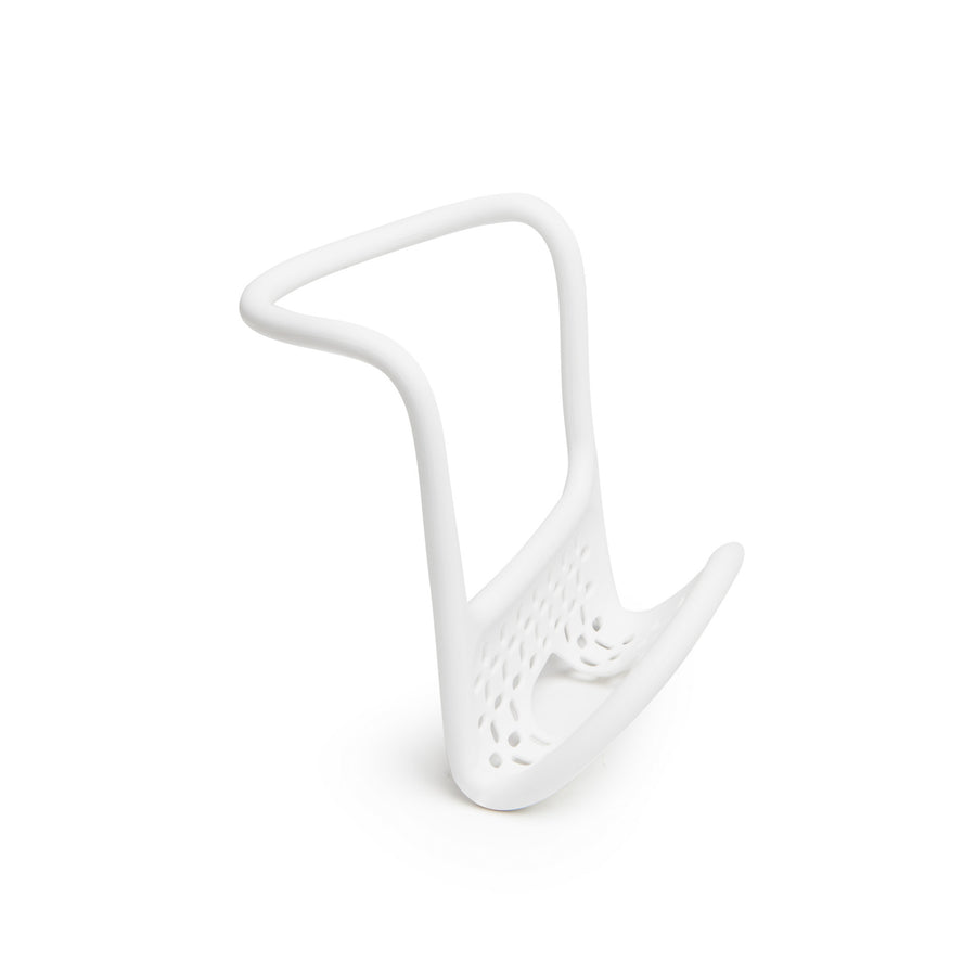 Umbra Sling flexible sink caddy in white on its own, showing the perforated drainage base