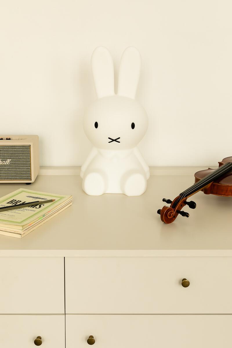 Mr Maria Miffy Star Light on a white dresser beside a violin