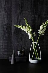 A Zakkia Concrete Cone - Ink handmade white vase with smooth finish.