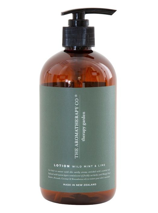 A bottle of Therapy® Garden Hand & Body Lotion - Wild Lime & Mint from The Aromatherapy Co with an earthy aroma.