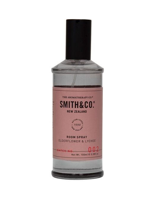 A bottle of The Aromatherapy Co Smith & Co Room Spray - Elderflower and Lychee, showcased on a white background.