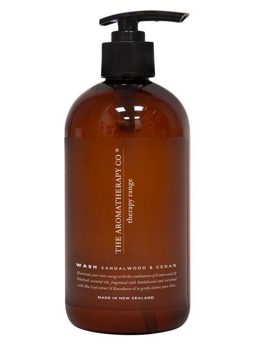 A bottle of the Therapy® Hand & Body Wash - Sandalwood & Cedar with a black pump featuring Sandalwood from The Aromatherapy Co.
