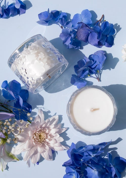 A FLWR Candle - FORGET ME NOT from The Aromatherapy Co intermingled with blooming jasmine.
