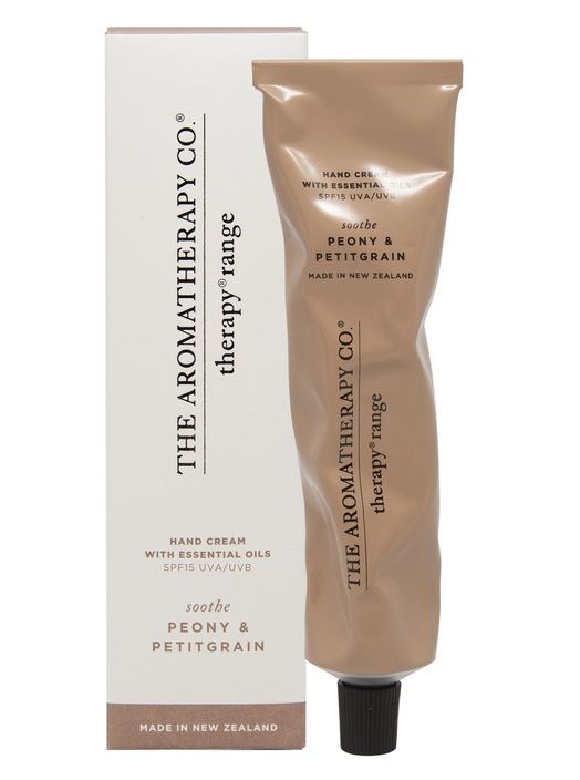 Peony & Petitgrain hand cream in a crinkled metallic blush tube standing beside its box