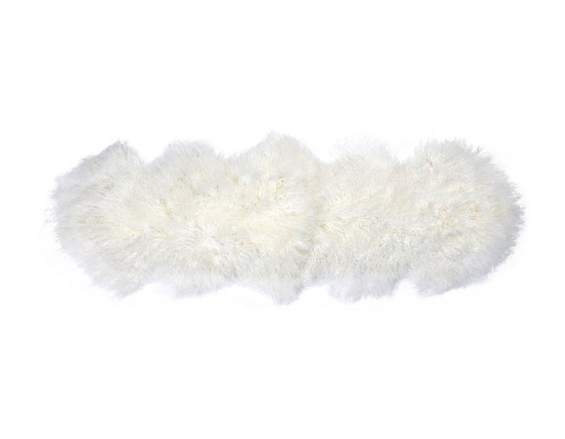 A luxurious Flux Home Tibetan lamb fur double rug on a white surface.