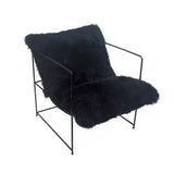 A black Sheepskin Occasional Chair with NZ Sheepskin and a metal frame, available for purchase and subject to freight costs.
