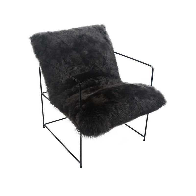 A black Flux Home Sheepskin Occasional Chair on a metal frame available for purchase in NZ with potential freight costs.