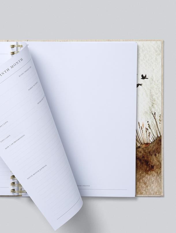 A Write To Me BABY | YOUR FIRST FIVE YEARS linen bound notebook with a bird on it.