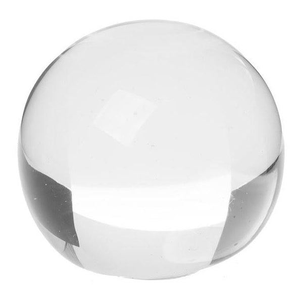 Small glass orb decor piece on a neutral background