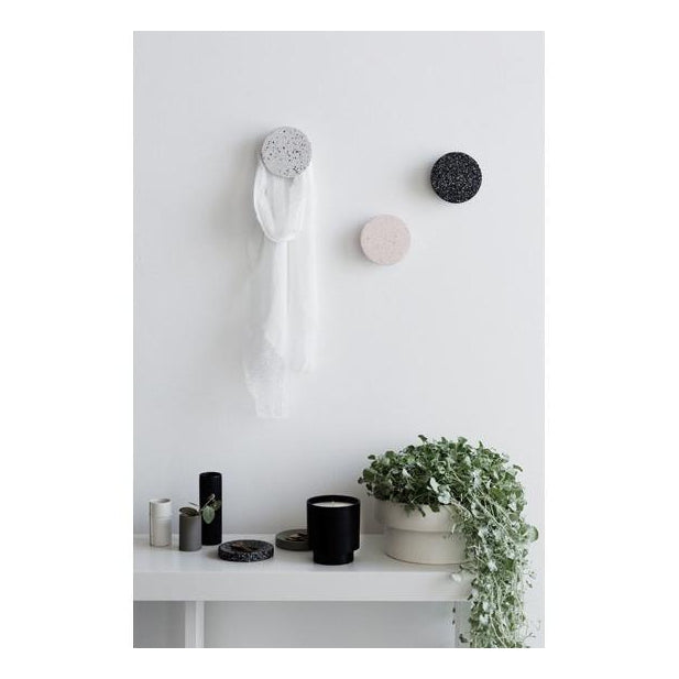 Zakkia terrazzo wall hook mounted on a wall holding a tote bag