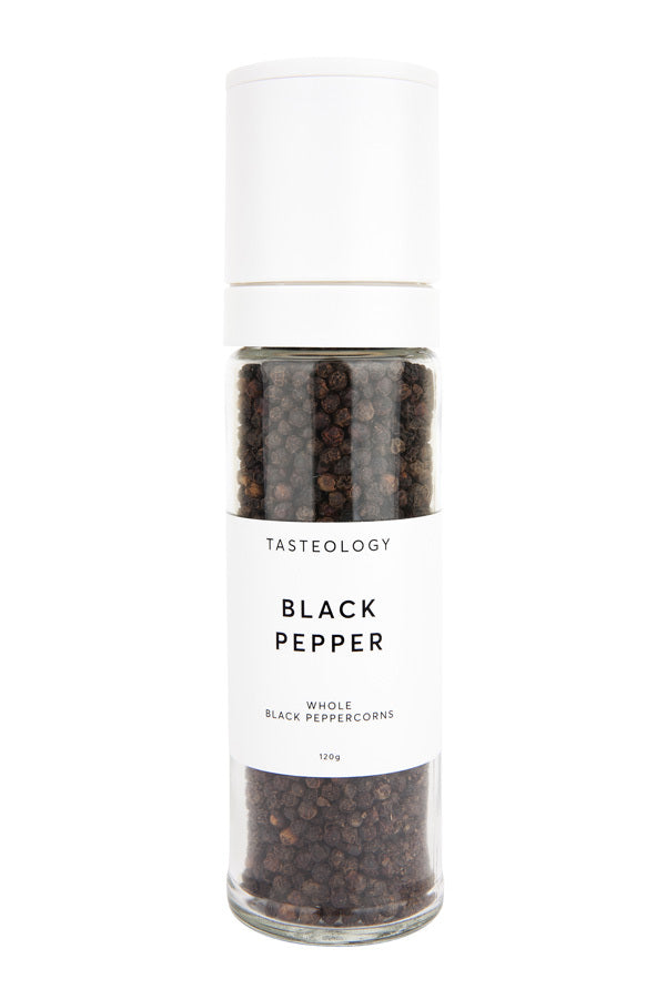 A jar of Tasteology Black Pepper peppercorns on a white background.