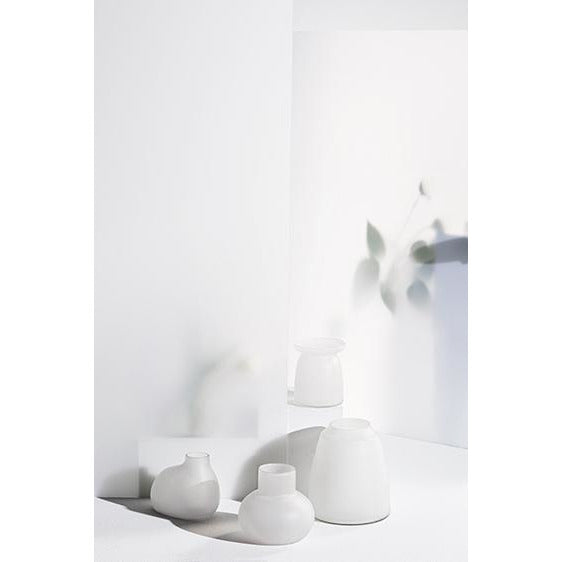 A group of Zakkia Tapered Vase - Frost on a white table.