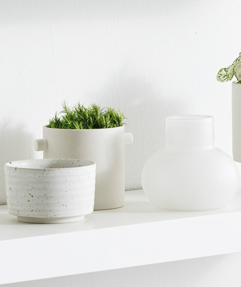 A white shelf with Zakkia's Bulb Vase Orb - Frost on it.