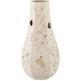 A Zakkia Carved Vase Curved - Confetti with speckles on it.
