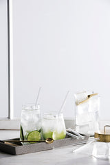 A tray with Zakkia glass drinking straws pack of 6 - short/long and a tray with reusable straws.