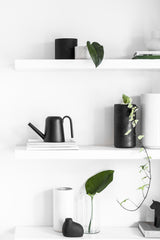 A white Embers Wall Planter - Small Ash with black and white vases, outdoor pots, and a plant using the reactive glaze process. (Brand: Zakkia)