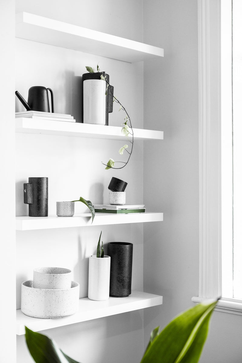A unique, black and white Embers Table Planter - Small Ash shelf with a plant on it by Zakkia.
