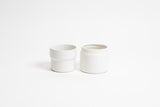Two Eldi Pots on a white surface from Ned Collections.