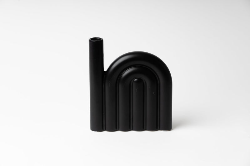 A Harold vase by Ned Collections on a white surface with a matte finish.