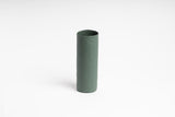 A small green Bernie Vase sitting on a white surface - Ned Collections Bernie Vase (Various Options).