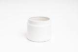 An Eldi Pots white ceramic mug on a white surface from Ned Collections.