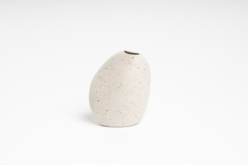 The Great Harmie Vase, crafted by talented Vietnamese Artisans and belonging to the Ned Collections brand, elegantly rests on a pristine white surface.