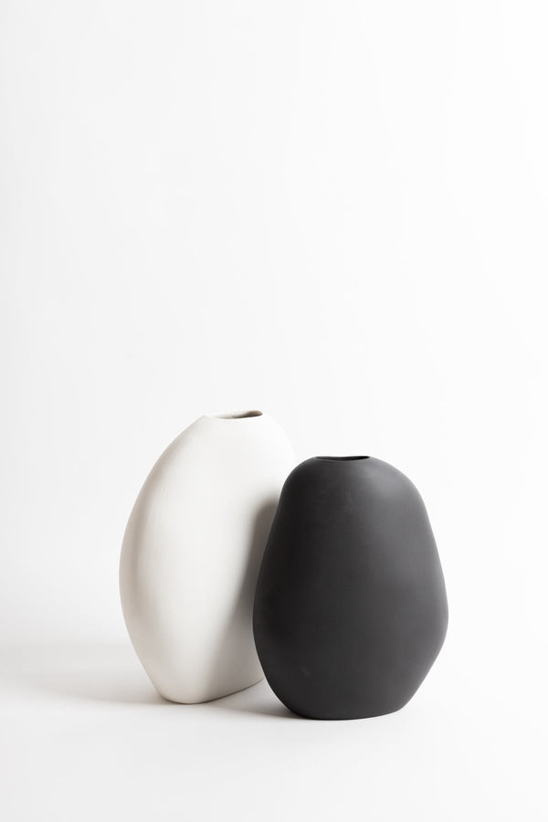 Two Harmie Vase - Various Options by Ned Collections black and white vases on a white surface.