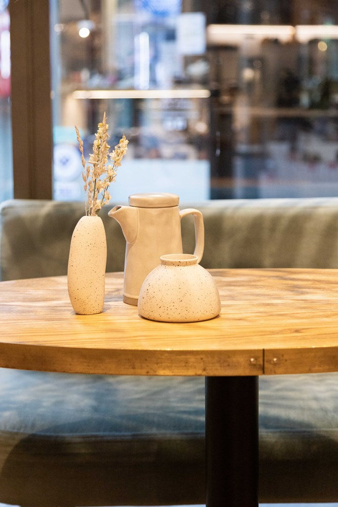 Two Harmie Vase Beau pieces styled on a wooden table
